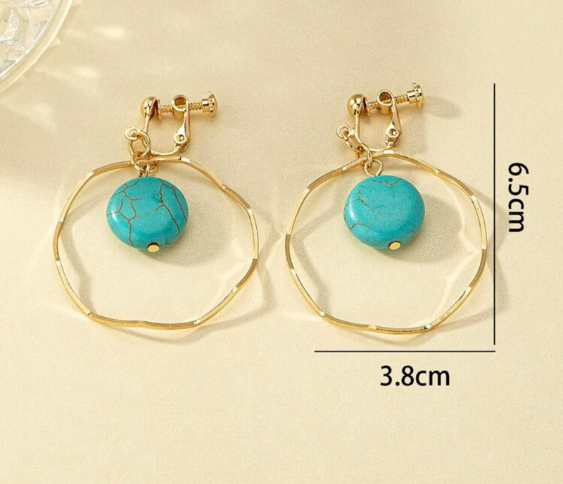 Clip on 2 1/4" gold zig zag hoop earrings with turquoise center stone