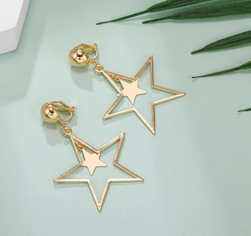 Clip on 2 1/4" gold cutout dangle star earrings