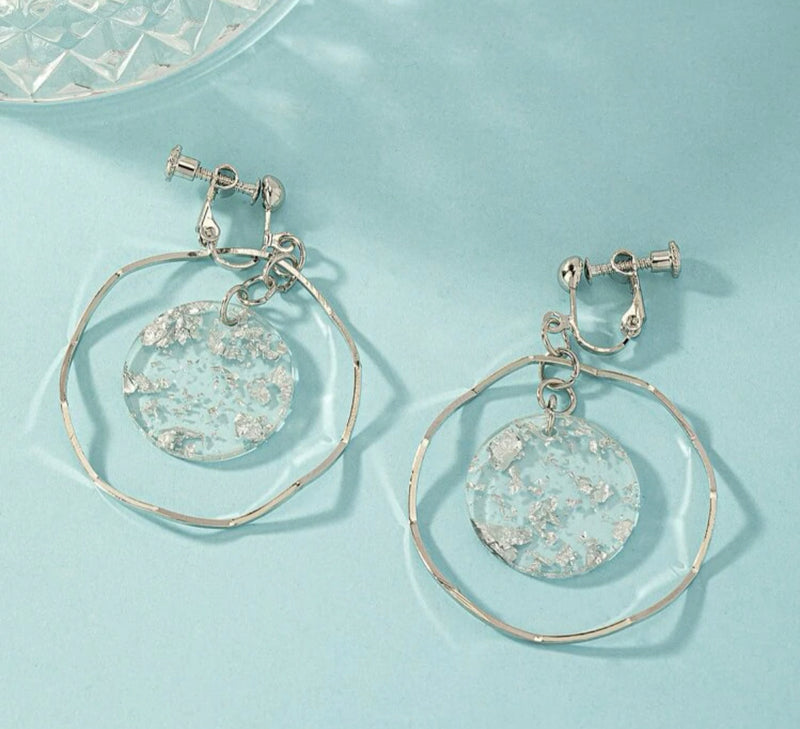 Clip on 2" silver wavy hoop earrings w/center silver glitter circle