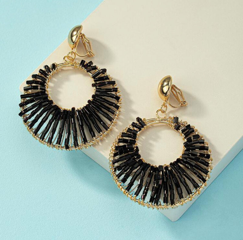 Clip on 2 1/4" gold and shiny black sequin hoop earrings