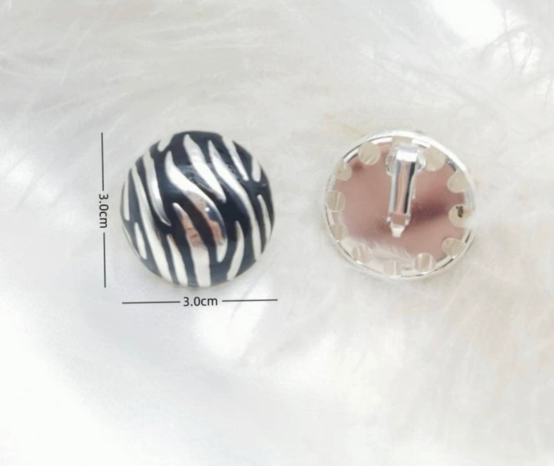 Clip on 1 1/4" silver and black animal print button style earrings