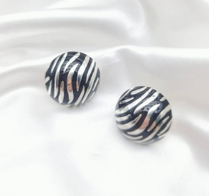 Clip on 1 1/4" silver and black animal print button style earrings