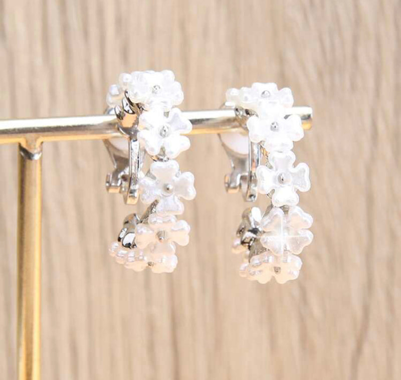Clip on 1" silver and white flower open back hoop earrings