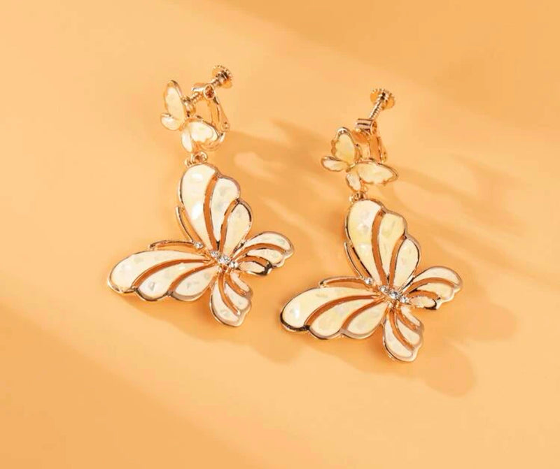 Clip on 2 1/4" rose gold, yellow cutout double butterfly earrings
