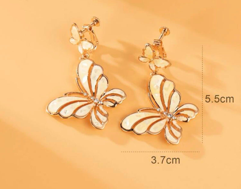 Clip on 2 1/4" rose gold, yellow cutout double butterfly earrings