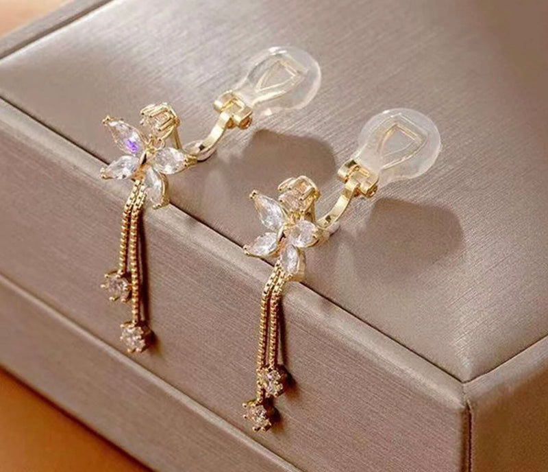 Clip on 1 3/4" gold & cream pearl pointed flower earrings w/clear stones