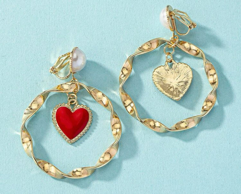 Clip on 2 1/2" gold and pearl twisted hoop earrings with center dangle red heart