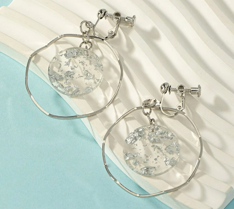 Clip on 2" silver wavy hoop earrings w/center silver glitter circle