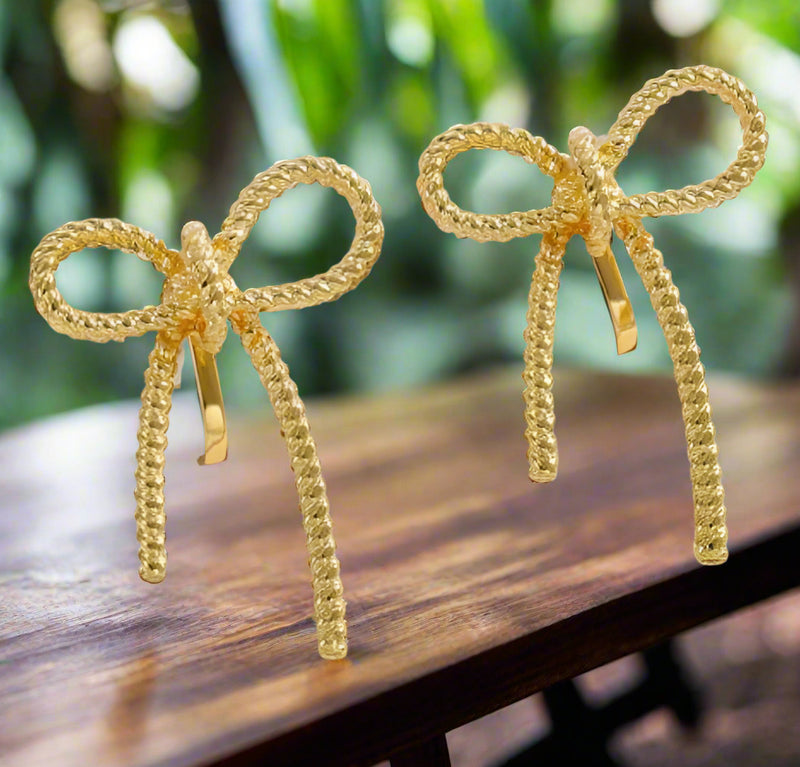 Clip on 1 1/4" gold textured indented bow tie earrings