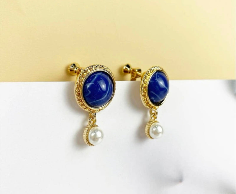 Clip on 1 1/4" gold, blue stone and white pearl earrings