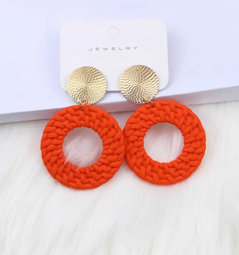 Clip on 2 1/2" gold woven hoop earrings in a variety of colors