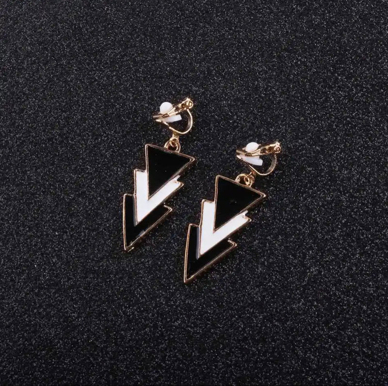 Clip on 1 3/4" gold, black and white pointed dangle earrings