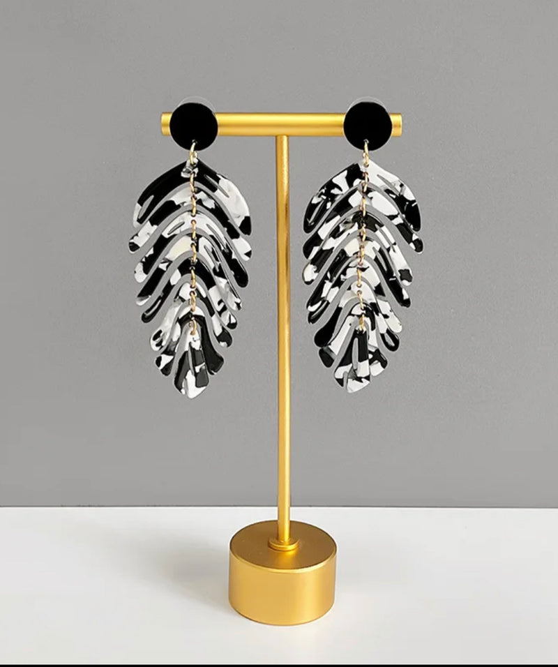 Clip on 3 3/4" long gold, black and white loose leaf dangle earrings