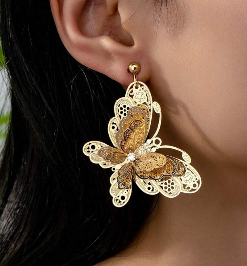 Clip on 2 1/4" gold filigree layered butterfly dangle earrings with clear stone