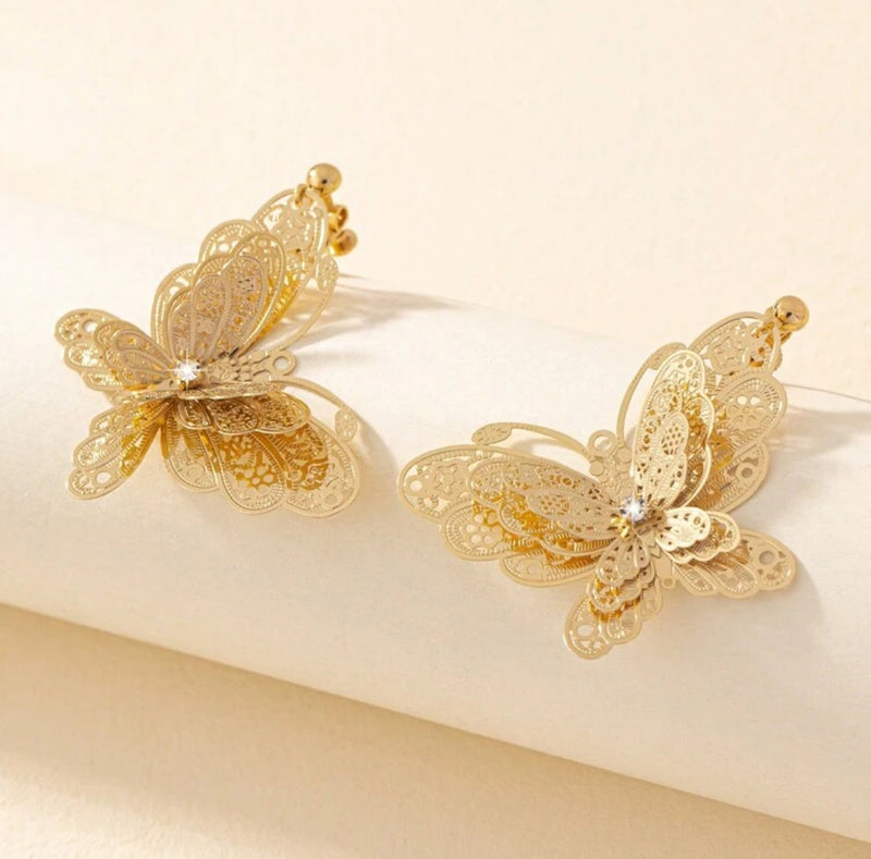 Clip on 2 1/4" gold filigree layered butterfly dangle earrings with clear stone