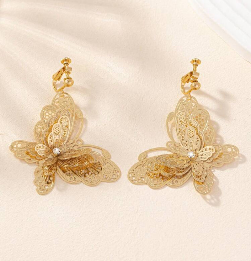 Clip on 2 1/4" gold filigree layered butterfly dangle earrings with clear stone