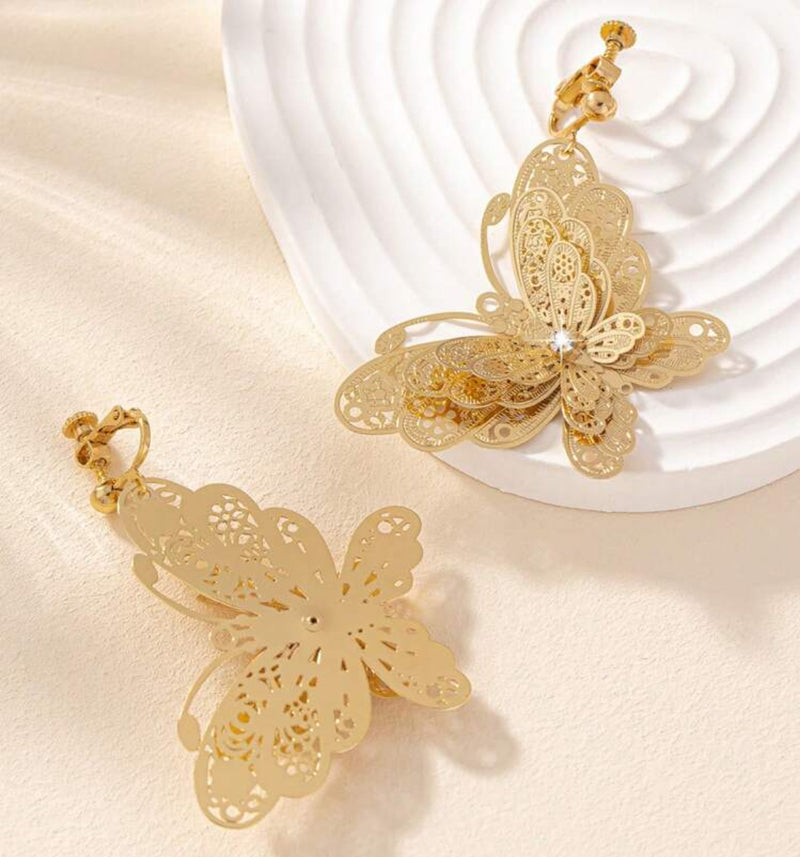 Clip on 2 1/4" gold filigree layered butterfly dangle earrings with clear stone