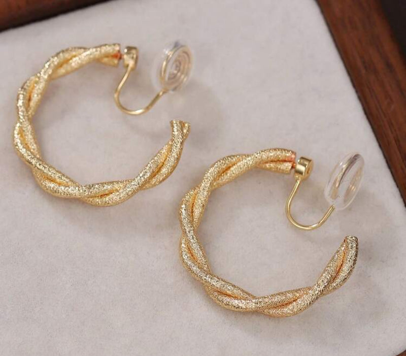Comfort fit 1 1/4" clip on shiny textured gold twisted dangle hoop earrings