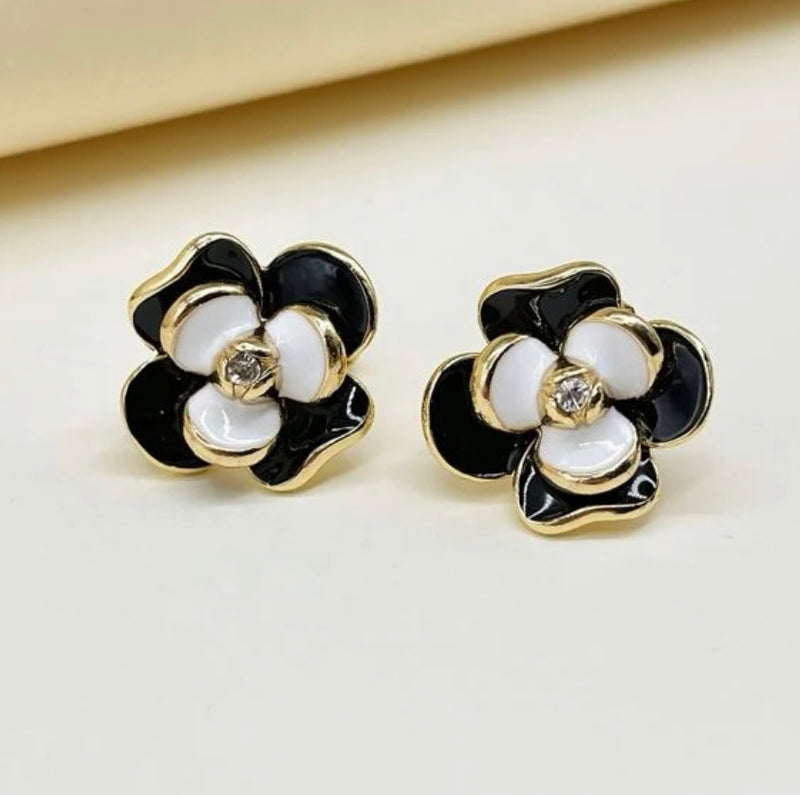 Clip on 1" gold, black and white flower earrings w/clear stone