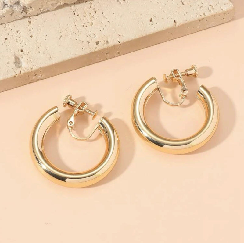 Clip on 1 1/4" shiny gold pipe style open back hoop earrings