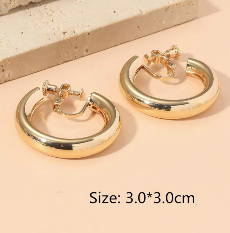 Clip on 1 1/4" shiny gold pipe style open back hoop earrings