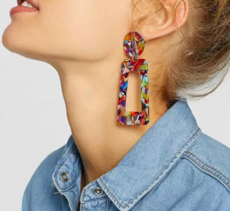 Classy clip on 3" long red petal dangle earrings with a center white pearl