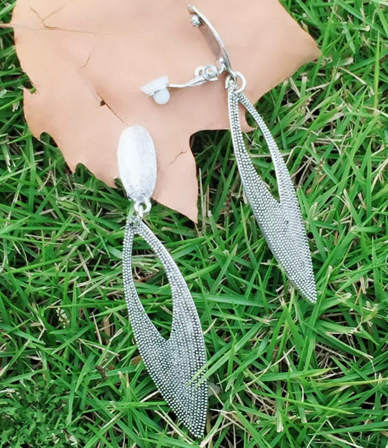 Clip on 3" long textured silver skinny cutout dangle earrings