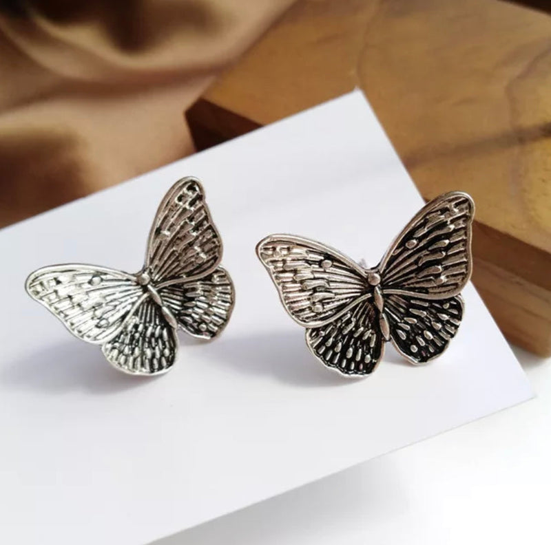 Clip on 3/4" silver and black textured butterfly small clasp earrings