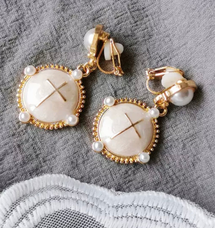 Clip on 1 3/4" gold, pearl and cream dangle earrings with cross