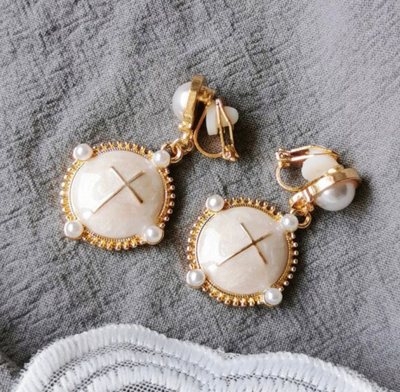 Clip on 1 3/4" gold, pearl and cream dangle earrings with cross