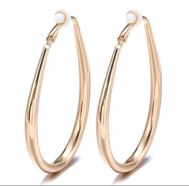 Clip on 2 1/2" large shiny gold oval hoop earrings