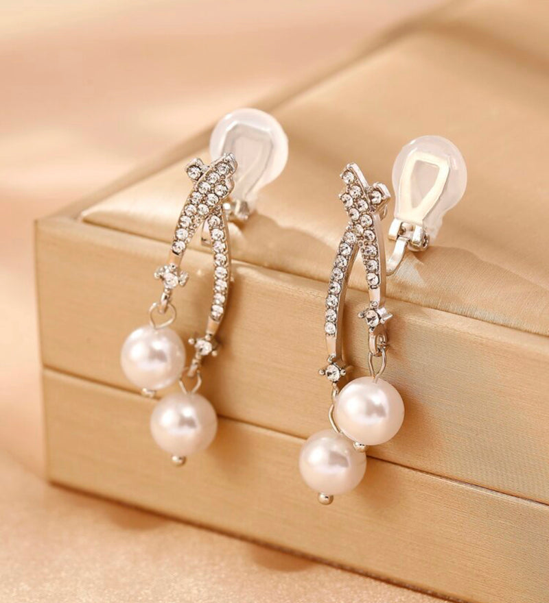 Clip on 1 1/2" gold, white pearl earrings with clear stone edges