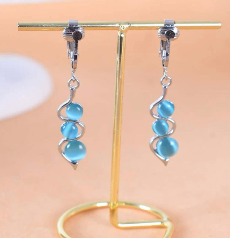 Clip on 2 1/4" silver and blue three bead dangle earrings