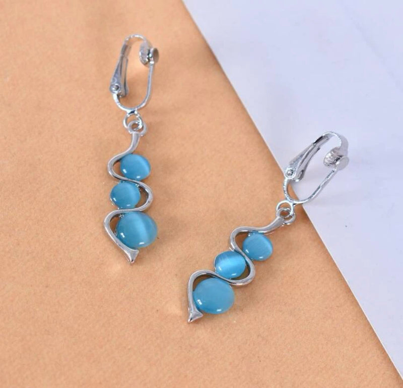 Clip on 2 1/4" silver and blue three bead dangle earrings