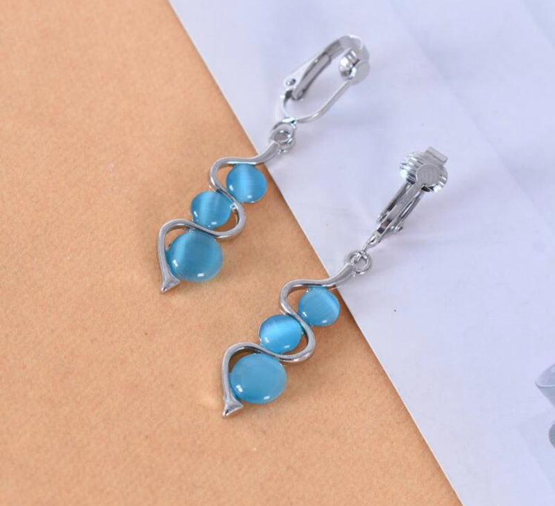 Clip on 2 1/4" silver and blue three bead dangle earrings