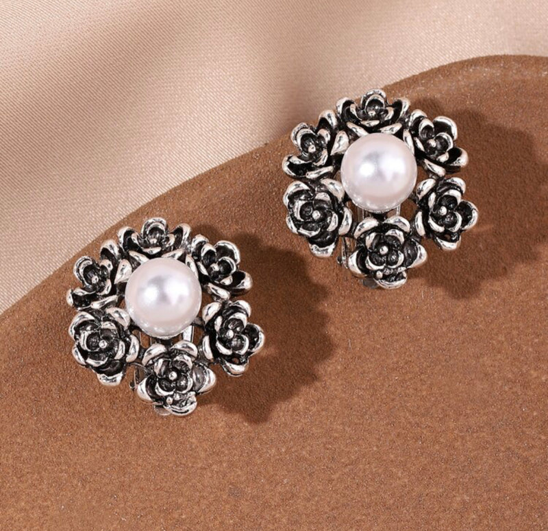 Clip on 3/4" silver and white pearl earrings with silver rose edges