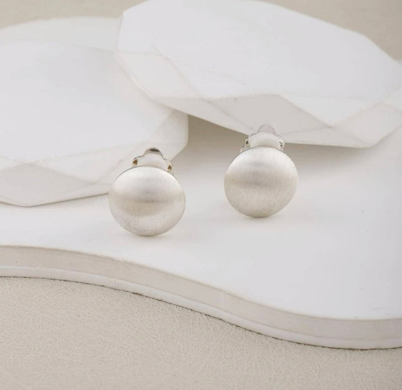 Clip on 1" brushed silver round button style earrings