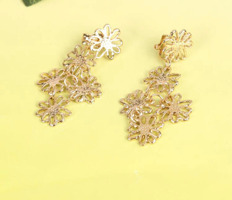 Clip on 2 1/4" gold dangle cutout multi flower earrings