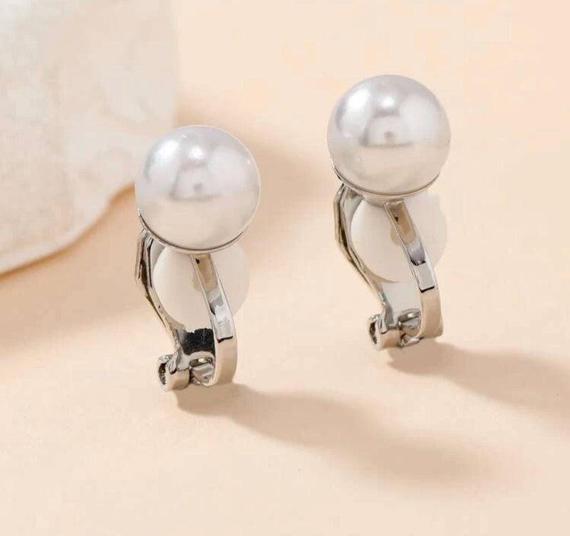 Clip on 1/2" silver and .03 cream pearl round button style earrings