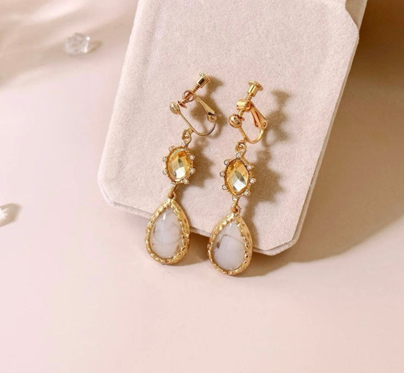 Clip on 2 1/4" gold and cream bead dangle earrings