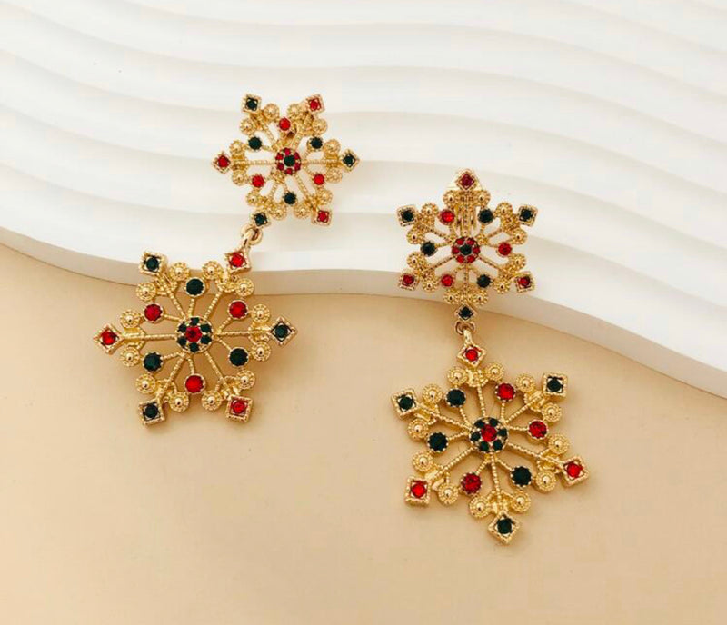 Clip on 2 3/4" long gold textured double snowflake earrings w/green & red stones