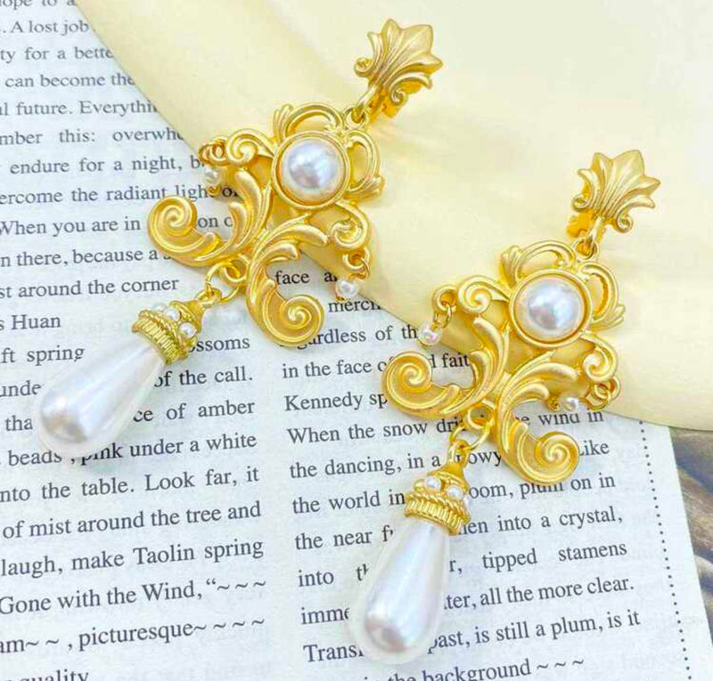 Clip on 1 1/2" gold, white pearl earrings with clear stone edges