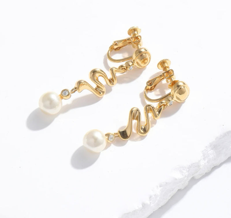 Clip on 1 3/4" gold zig zag earrings with dangle clear stone and pearl