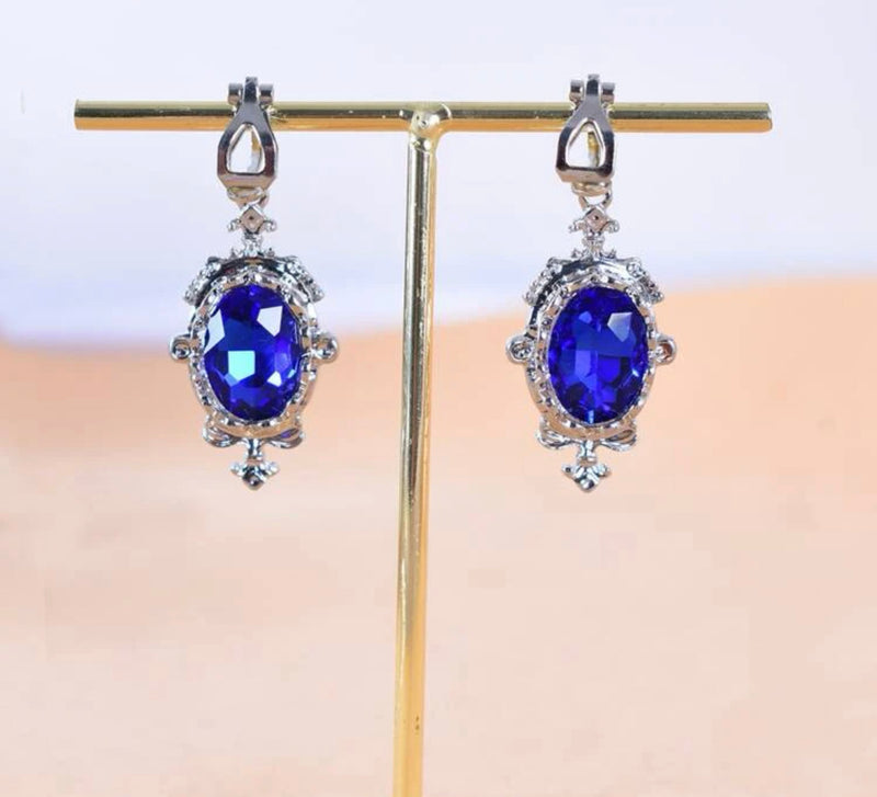 Clip on 1 3/4" silver pointed edge blue stone earrings