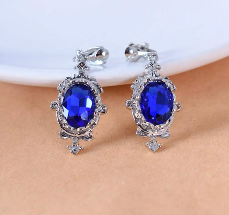 Clip on 1 3/4" silver pointed edge blue stone earrings