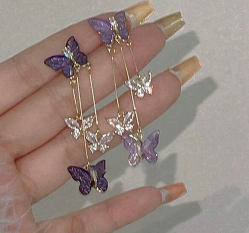 Pierced 2 1/4" gold, clear and purple stone butterfly earrings