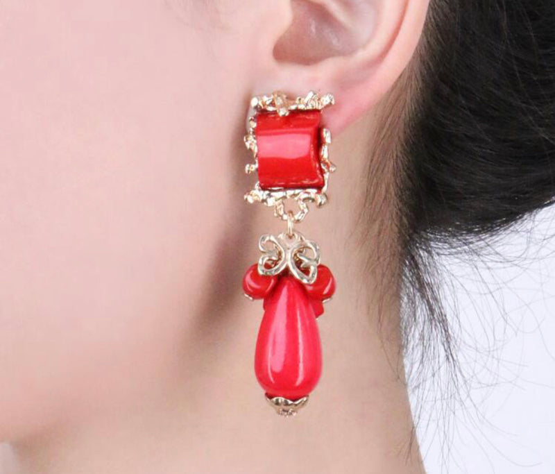 Clip on 2 3/4" gold and red stone earrings with dangle beads