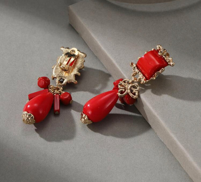 Clip on 2 3/4" gold and red stone earrings with dangle beads