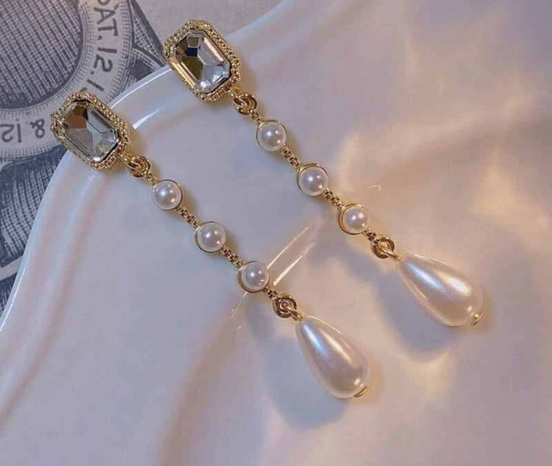 Clip on 2 1/4" gold and clear stone dangle pearl earrings