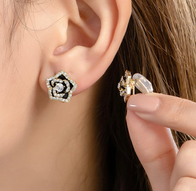 Clip on 1/2" small gold and black clear stone flower earrings